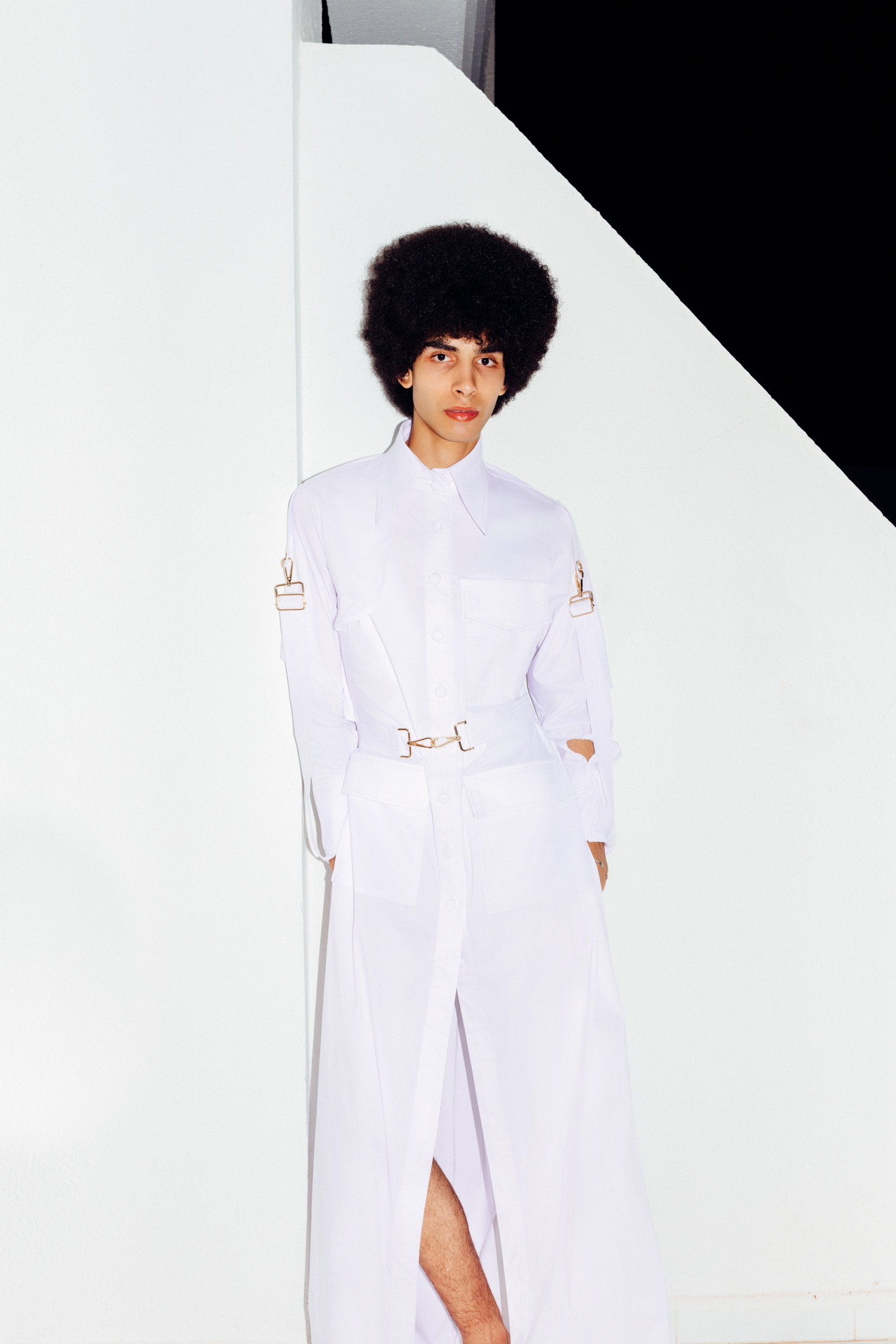 tunisian Model Yassin Walhezi with Afro hair is wearing a white dress by Soltana